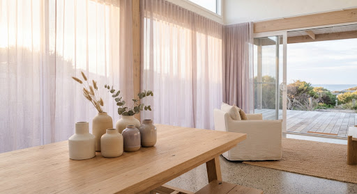 A sunlit coastal home saved to an active vision board